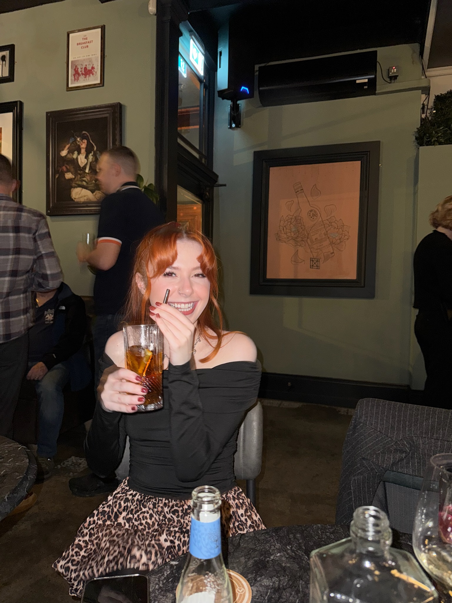 Bethan having a drink at a bar