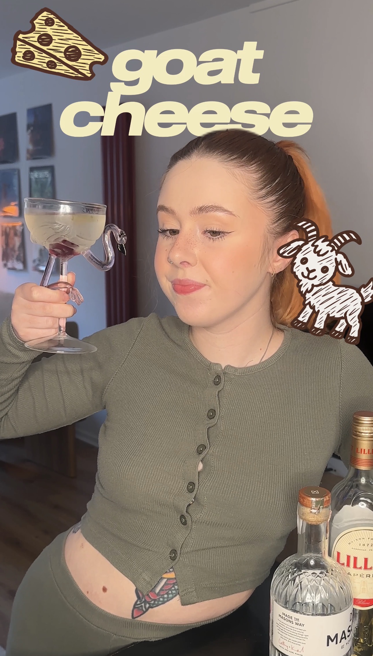 Bethan holding a goat cheese martini in a flamingo glass