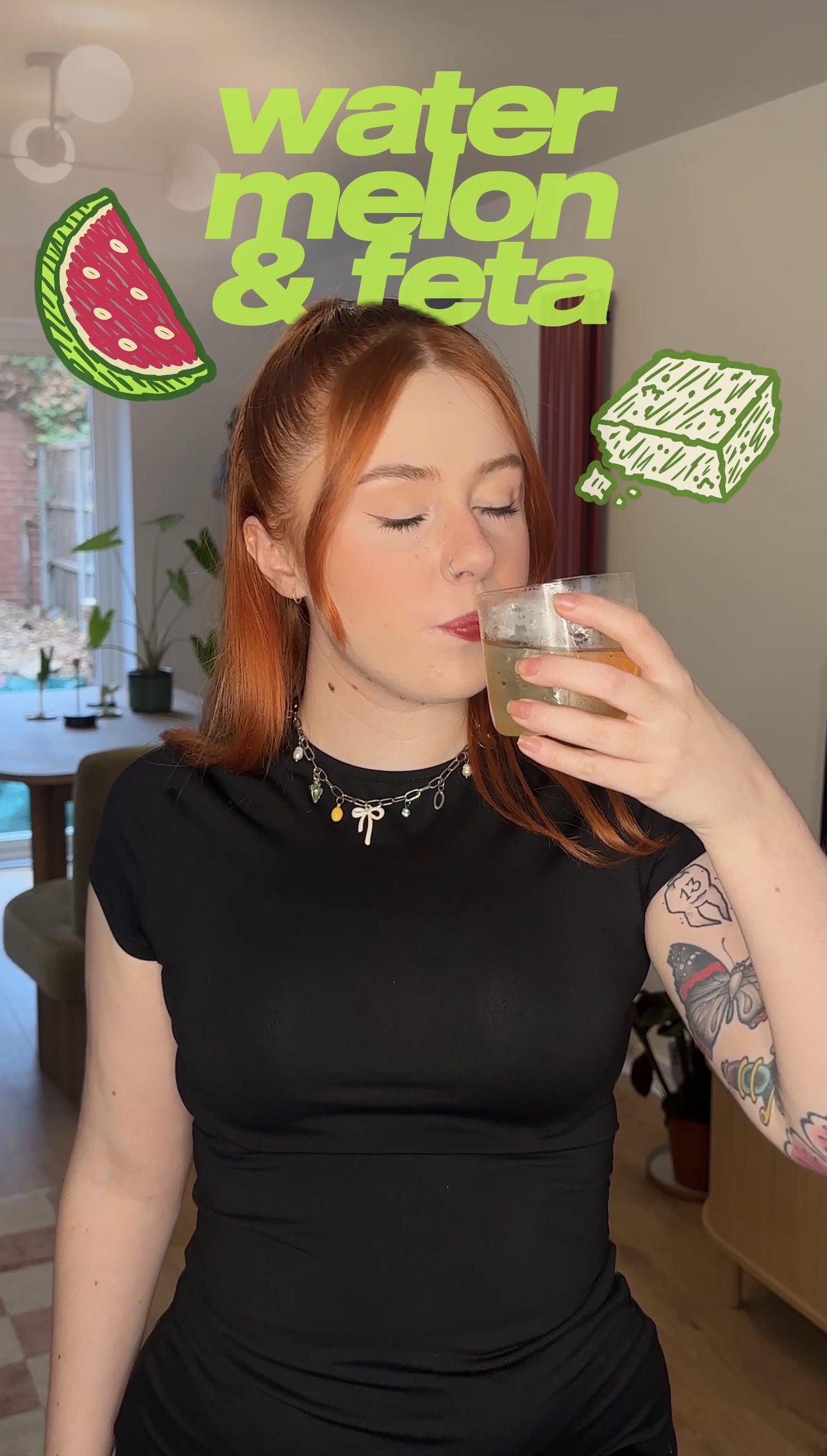 Bethan drinking a Watermelon Feta Negroni with watermelon and feta doodles
